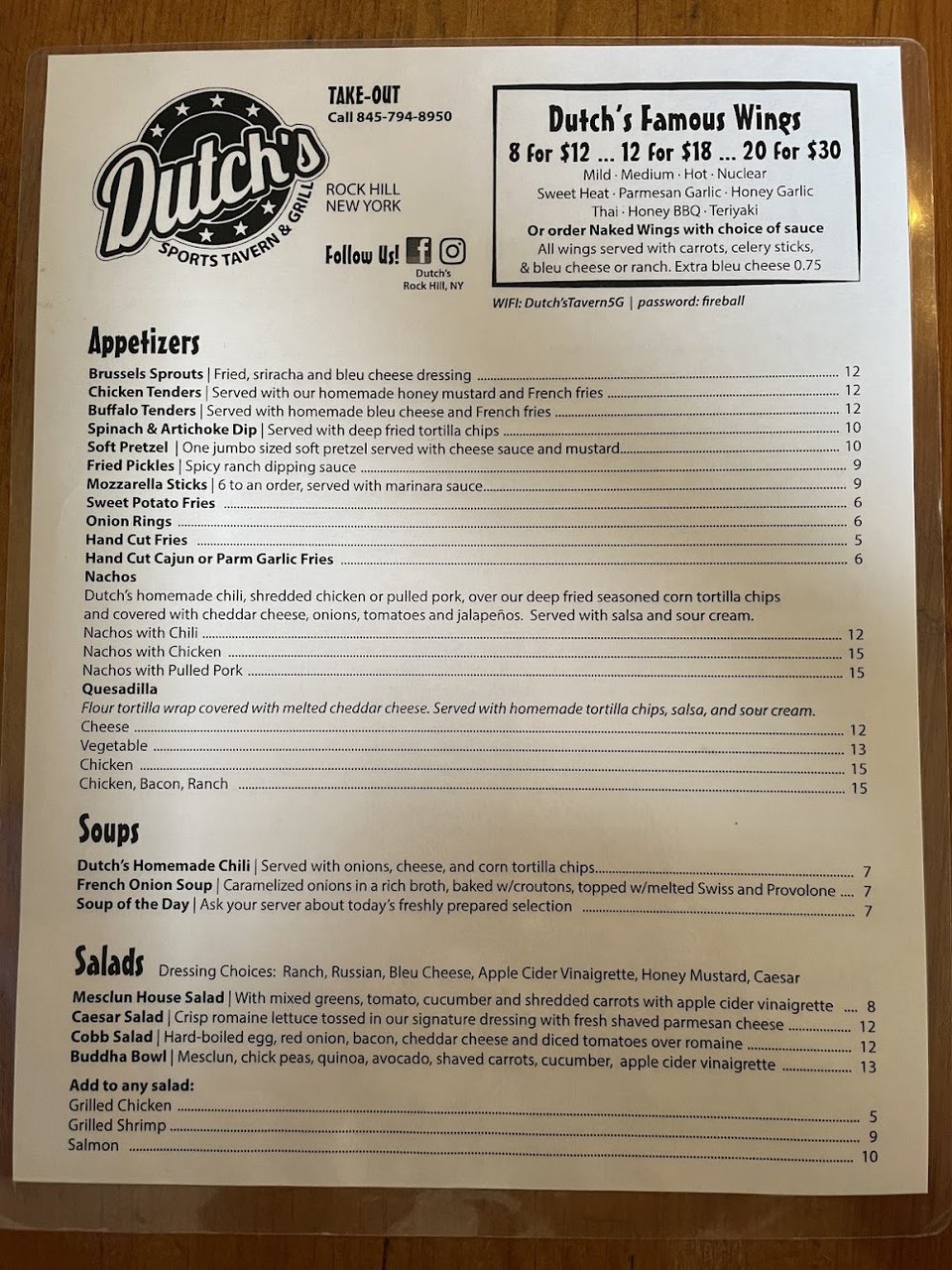 Restaurant menu laid out on a table.